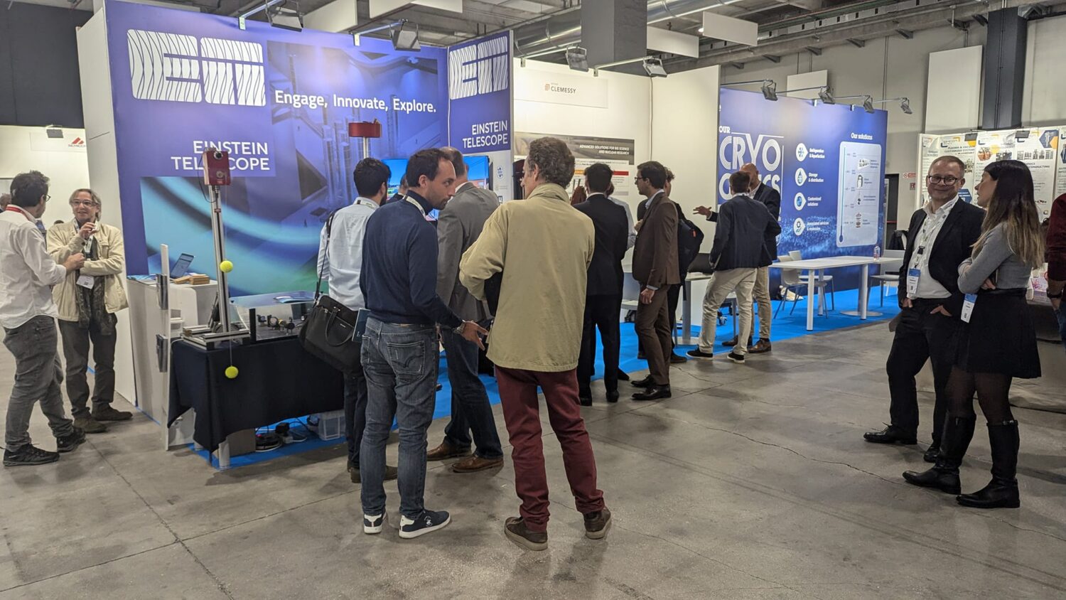 The photo shows a group of people experiencing the BSBF meeting in Trieste 2024 and chatting.