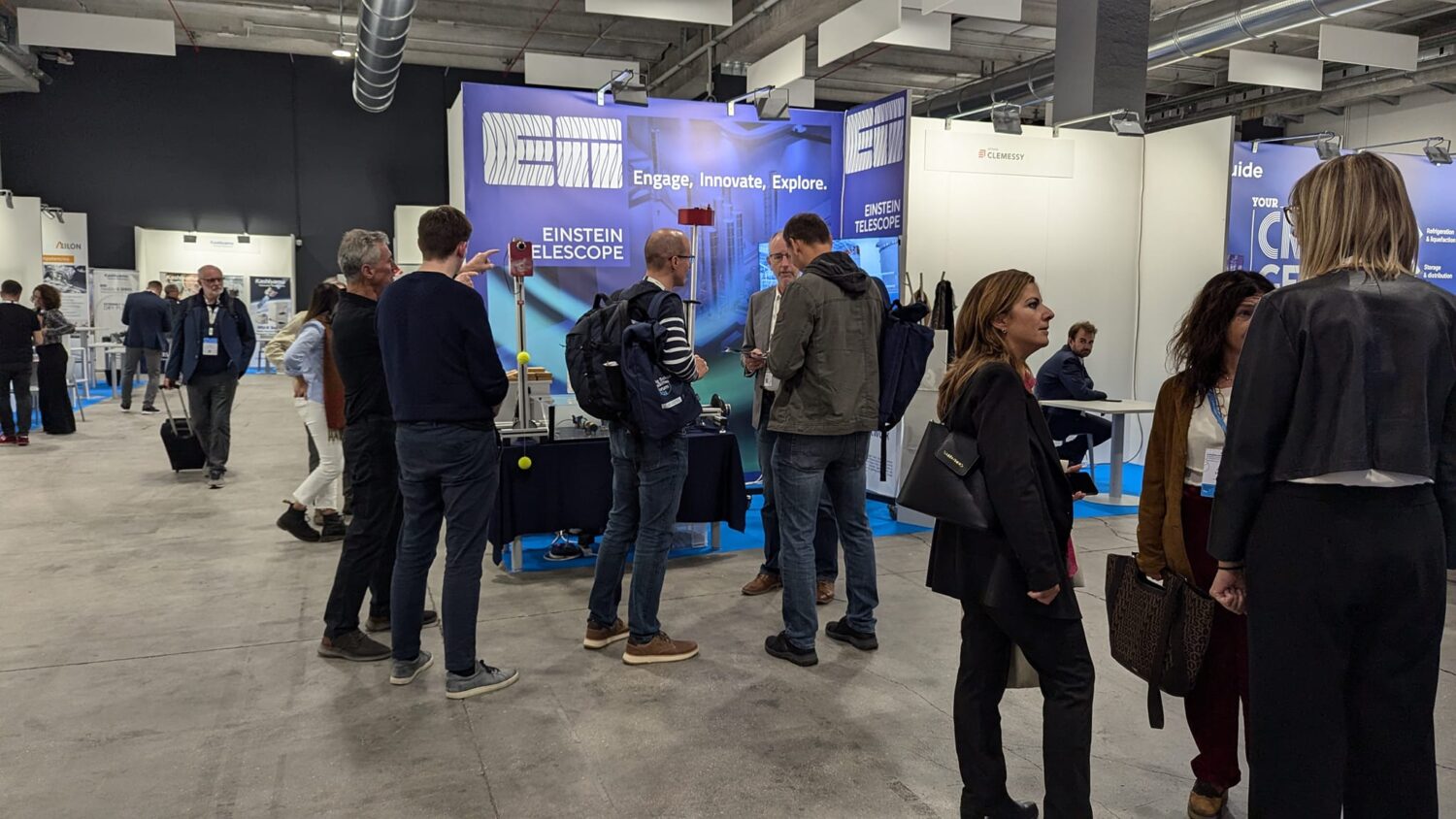 The photo shows a group of people experiencing the BSBF meeting in Trieste 2024 and chatting.