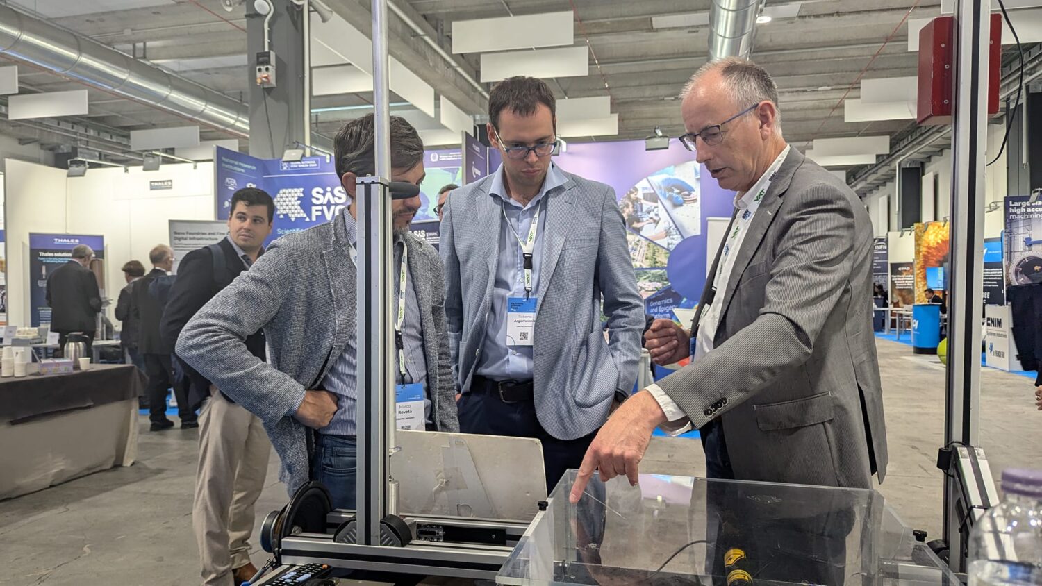 The photo shows a group of people experiencing the BSBF meeting in Trieste 2024 and chatting.