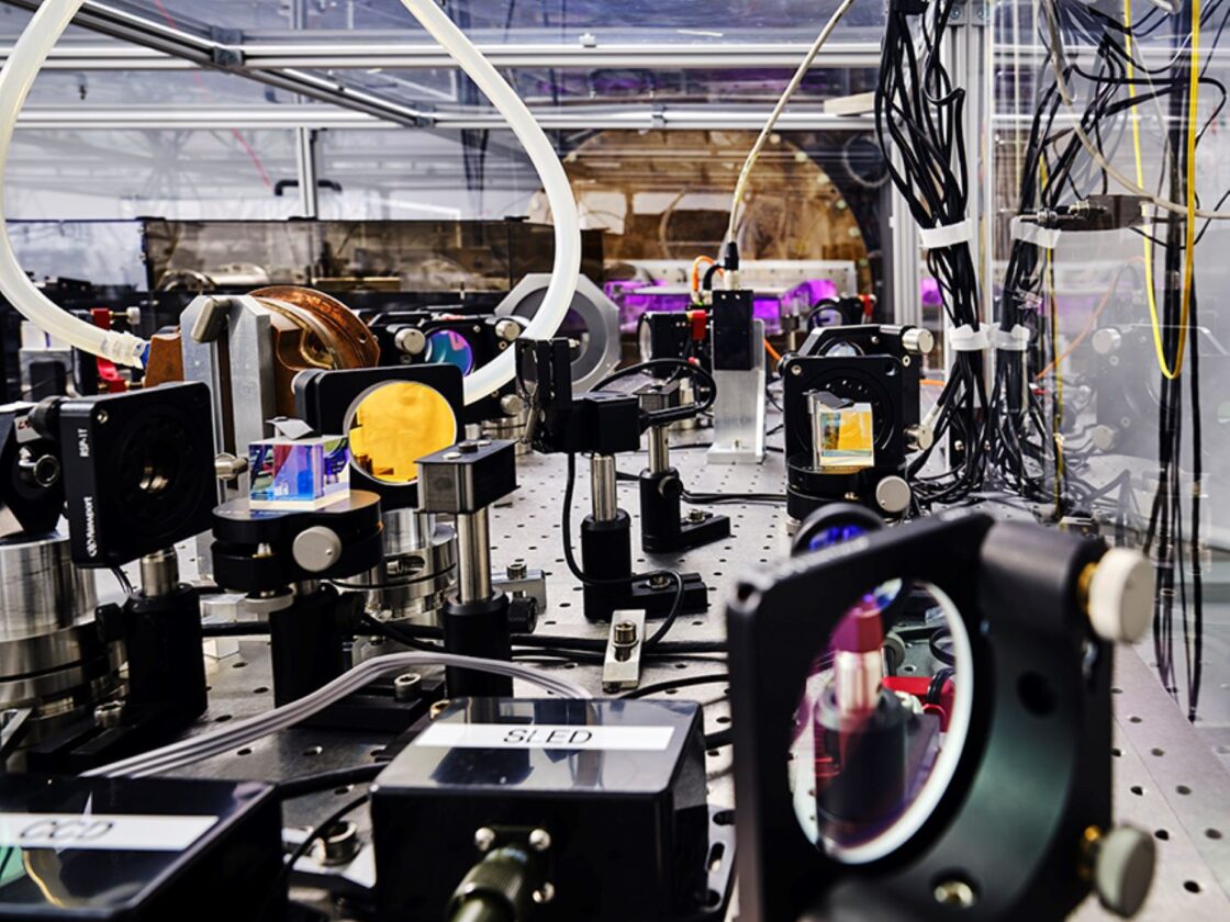 An image shows one of the optical benches of the Virgo gravitational wave detector.
