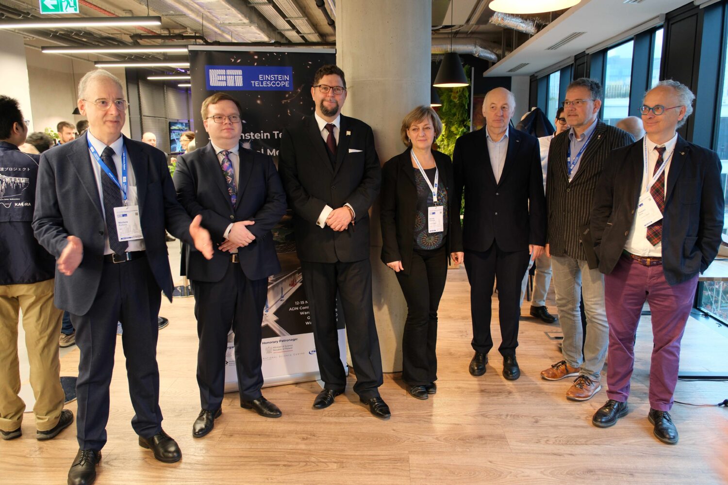 The photo shows a group of people posing for a photo during the ET annual meeting in Warsaw 2024.